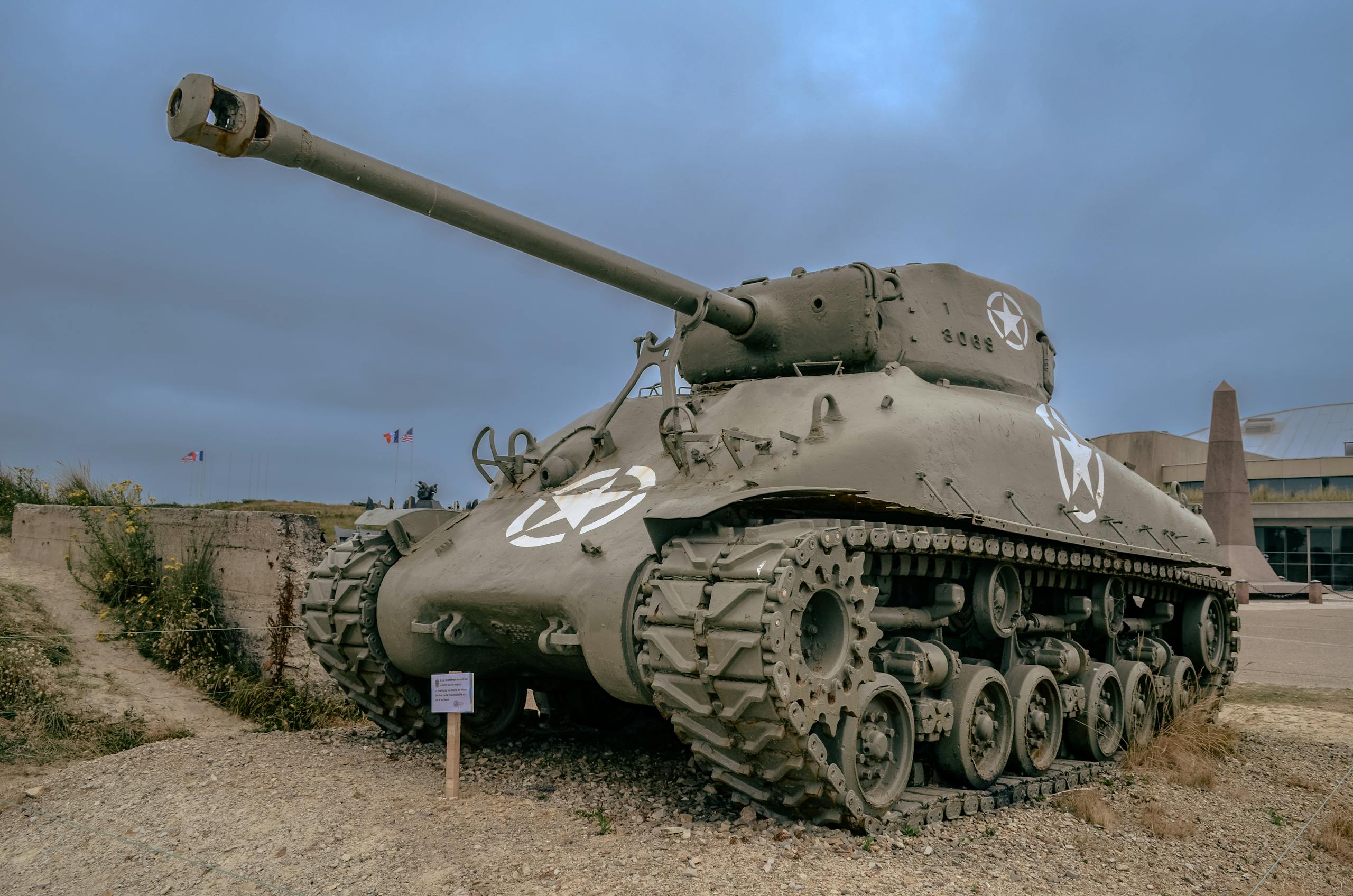 A WWII Sherman tank displayed in Normandy, France, significant for historical tours.