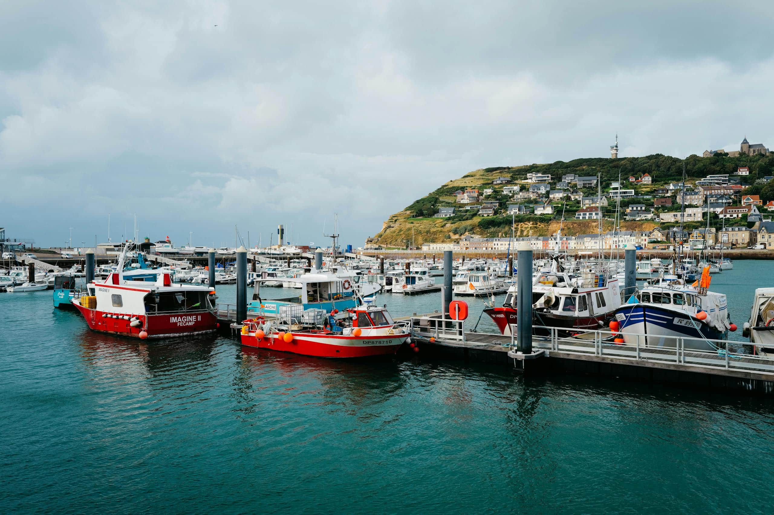 Historical World War II bunker located at Normandy, France with concrete fortification and gun turret.