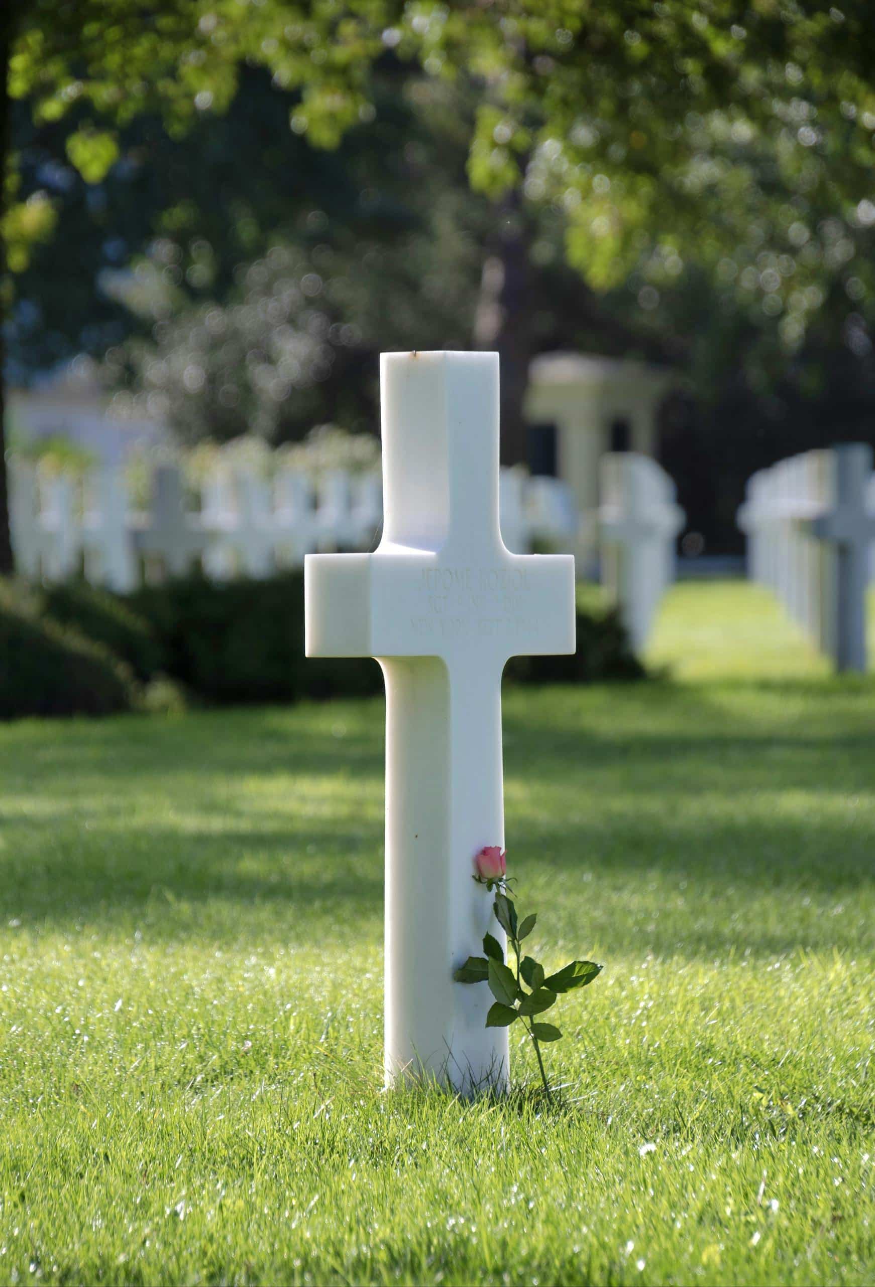 Historical World War II bunker located at Normandy, France with concrete fortification and gun turret.